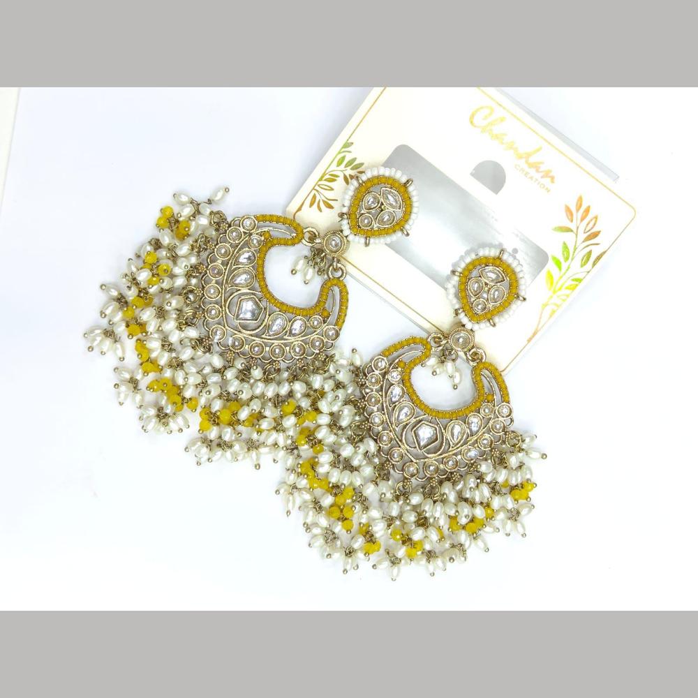 Pooja Bangles Gold Plated Kundan Stone And Pearl Dangler Earrings