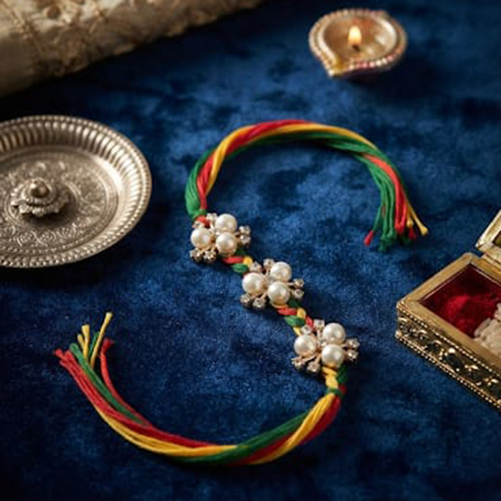 Palak Art Elegant Pearl Rakhi With Traditional Design