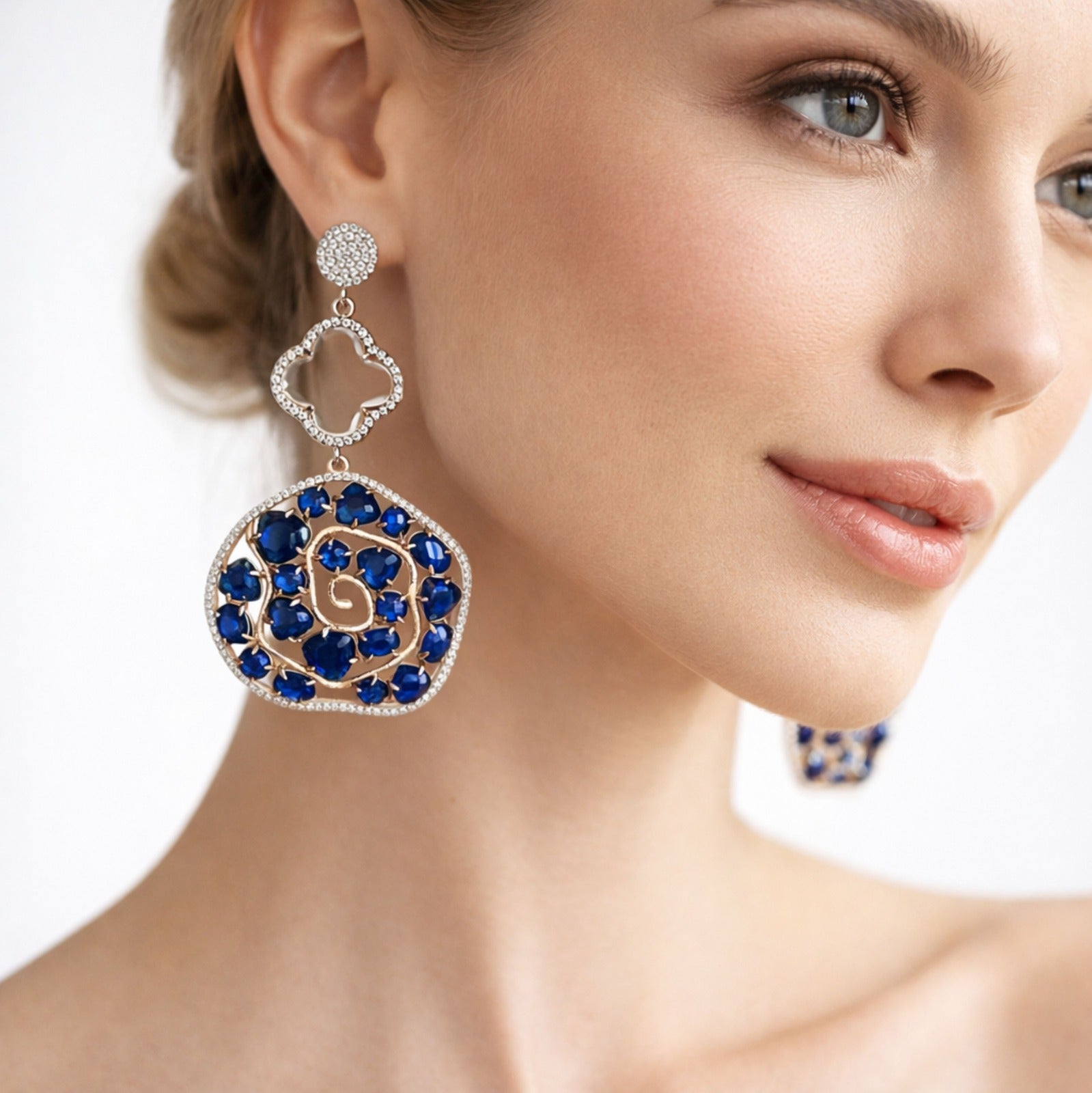 Jewel Treatzz Irregular Shaped Blue Doublet Stone, Transparent Four Petal Clover Flower And CZ Stone Gold Plated Chandlelier Earrings