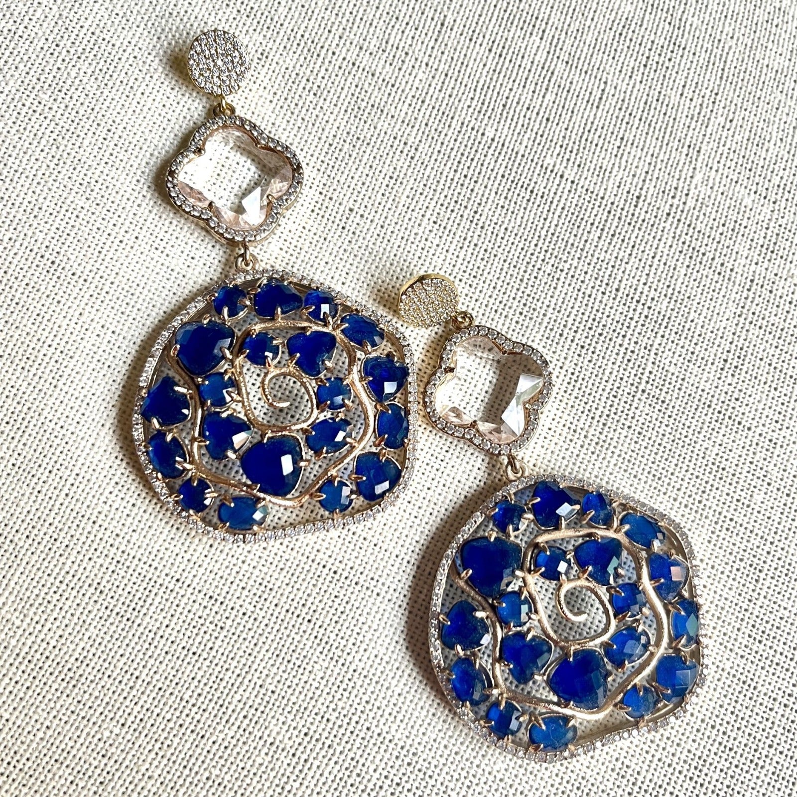 Jewel Treatzz Irregular Shaped Blue Doublet Stone, Transparent Four Petal Clover Flower And CZ Stone Gold Plated Chandlelier Earrings