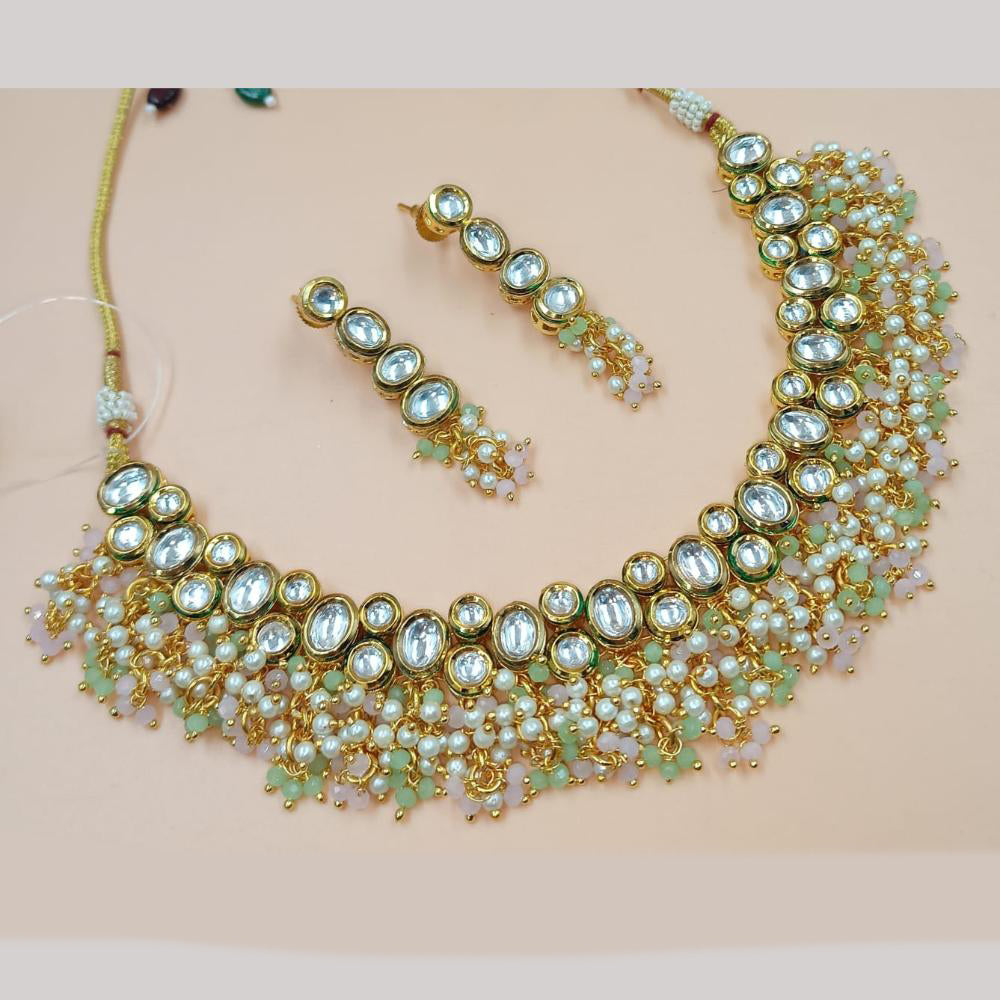 NAFJ Gold Plated Kundan Stone And Pearls Necklace Set