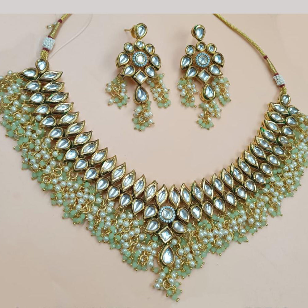NAFJ Gold Plated Kundan Stone And Pearls Necklace Set
