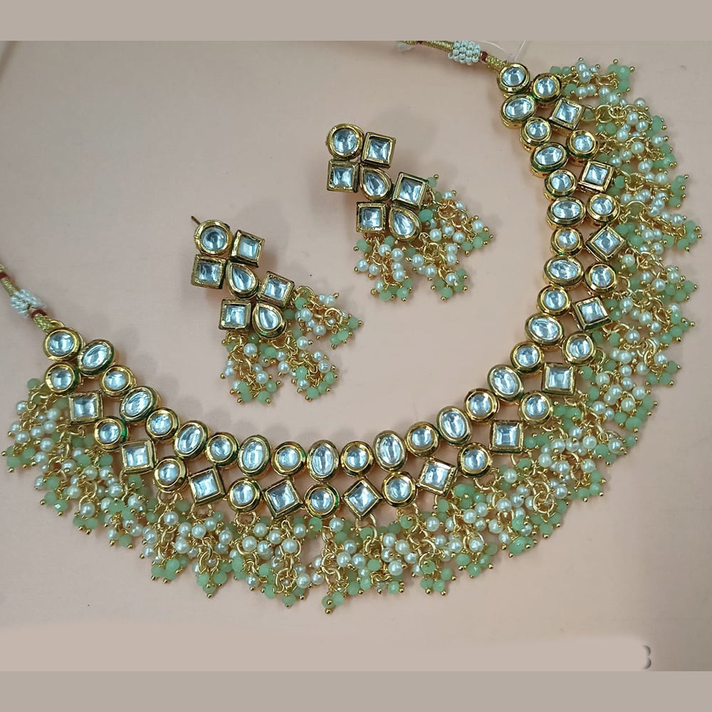 NAFJ Gold Plated Kundan Stone And Pearl Necklace Set