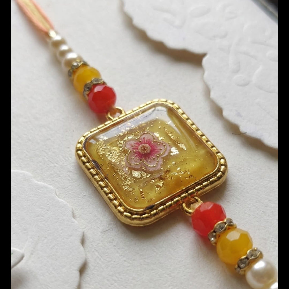 Dhirish International Thread Rakhi for a Memorable and Spiritually Rich Celebration