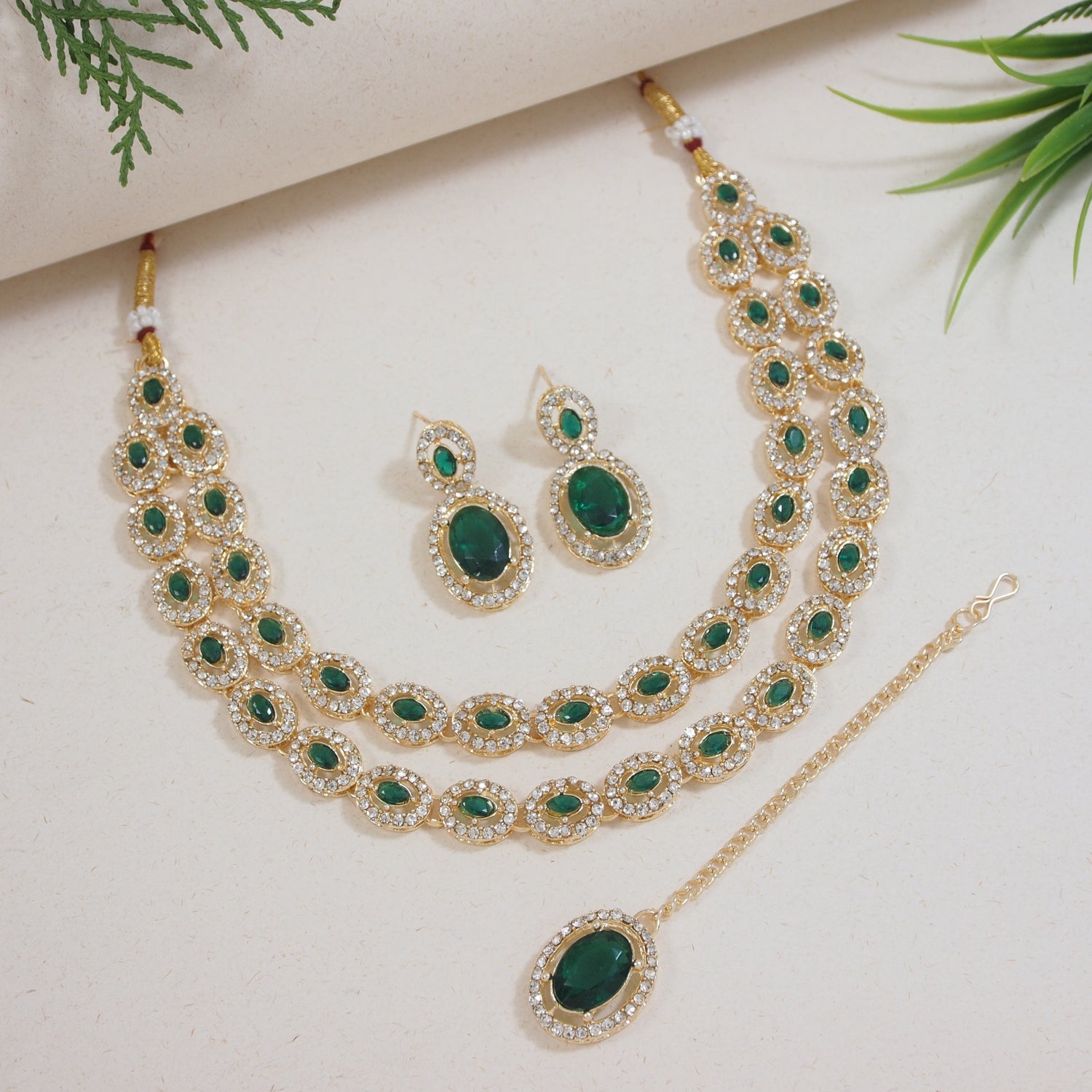 Etnico Gold Plated Stylish Design Crystal Diamond Oval Shape Necklace With Earrings & Maang Tikka Jewellery Set for Women (IJ405M)