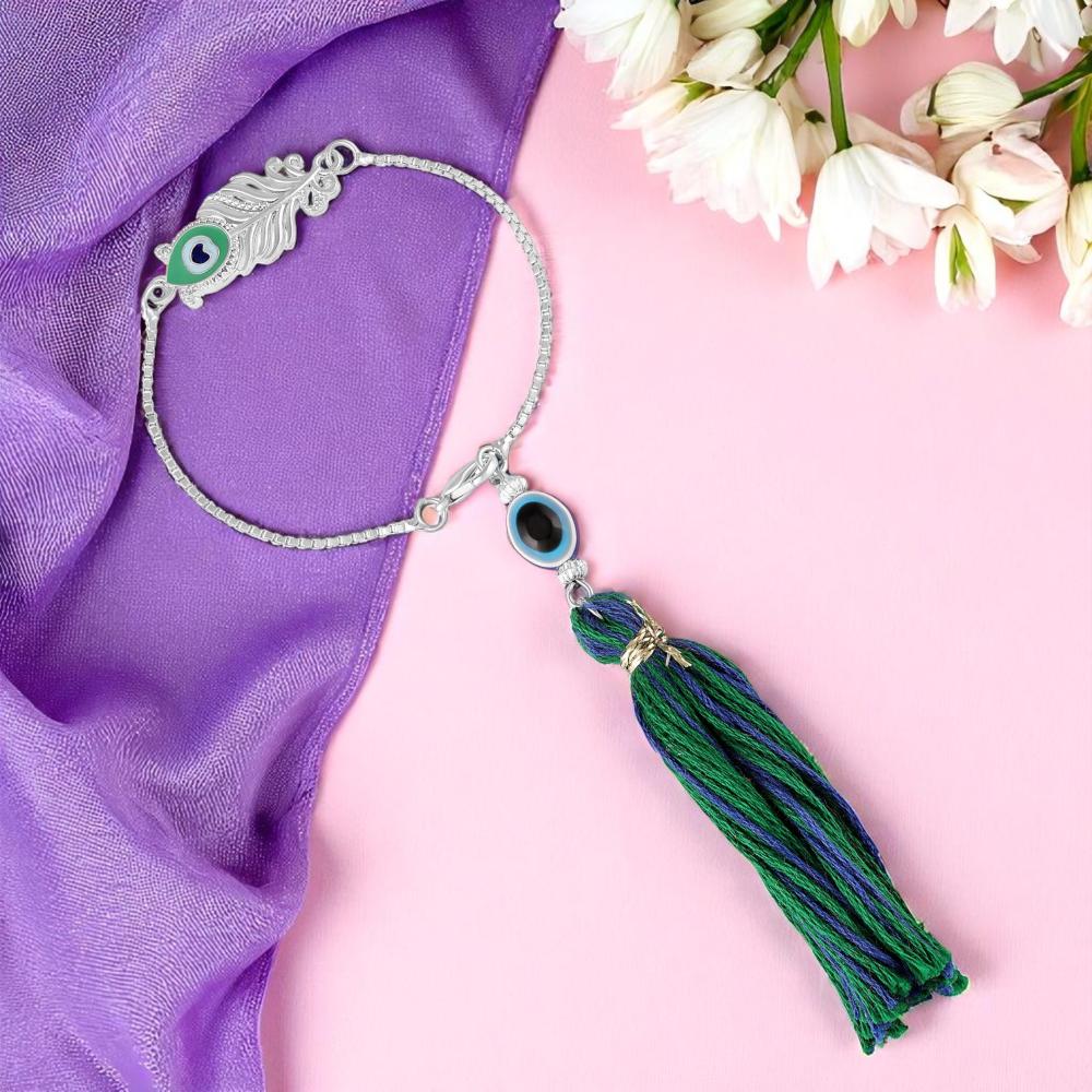 Mahi Lumba Rakhi of Peacock-Feather-Themed Bhabhi Rakhi with Evil Eye & Silk Tassel Bracelet (RAL1100846R)