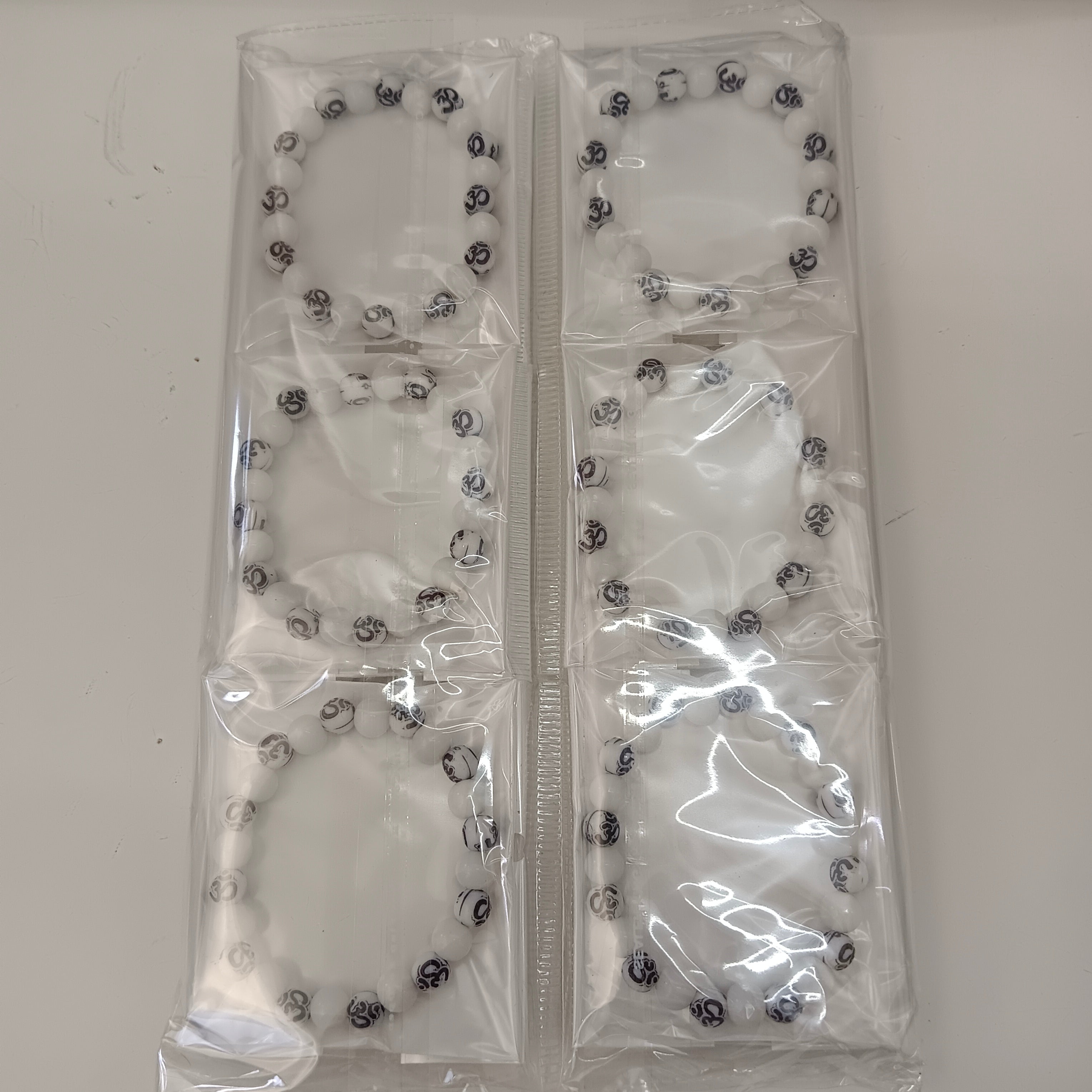 Urthn Om Beads Bracelet  (Set Of 12)