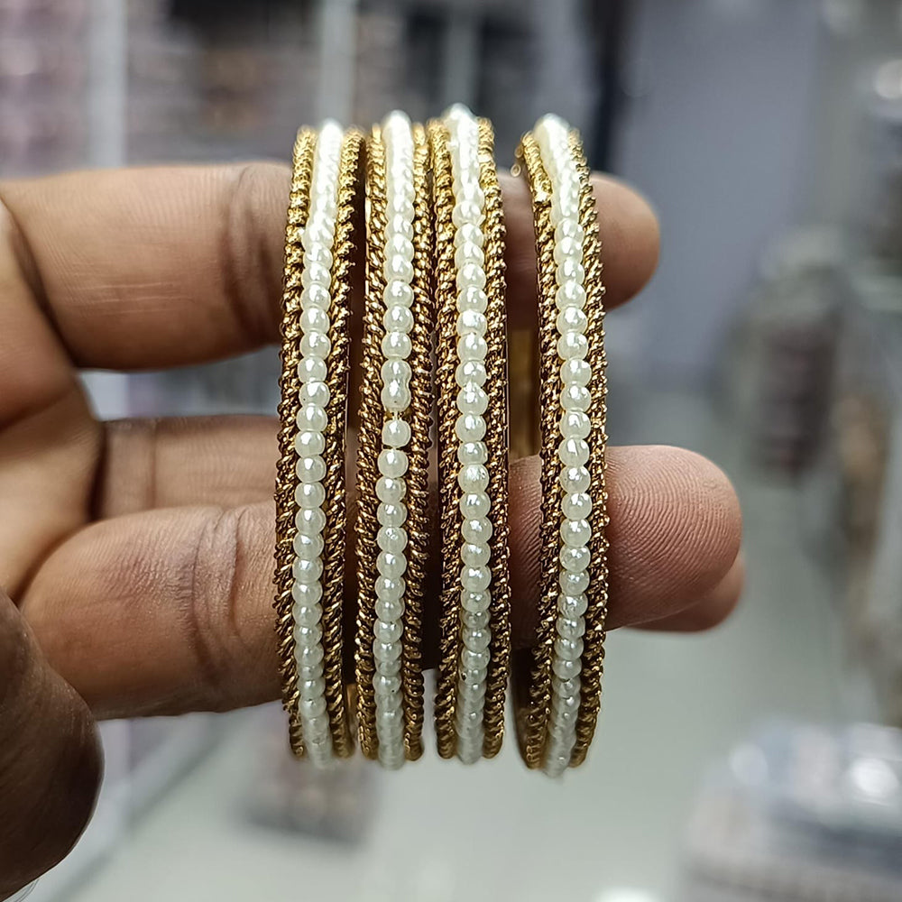 Pratima Jewellery Mart Elegant Pearl Bangles Set