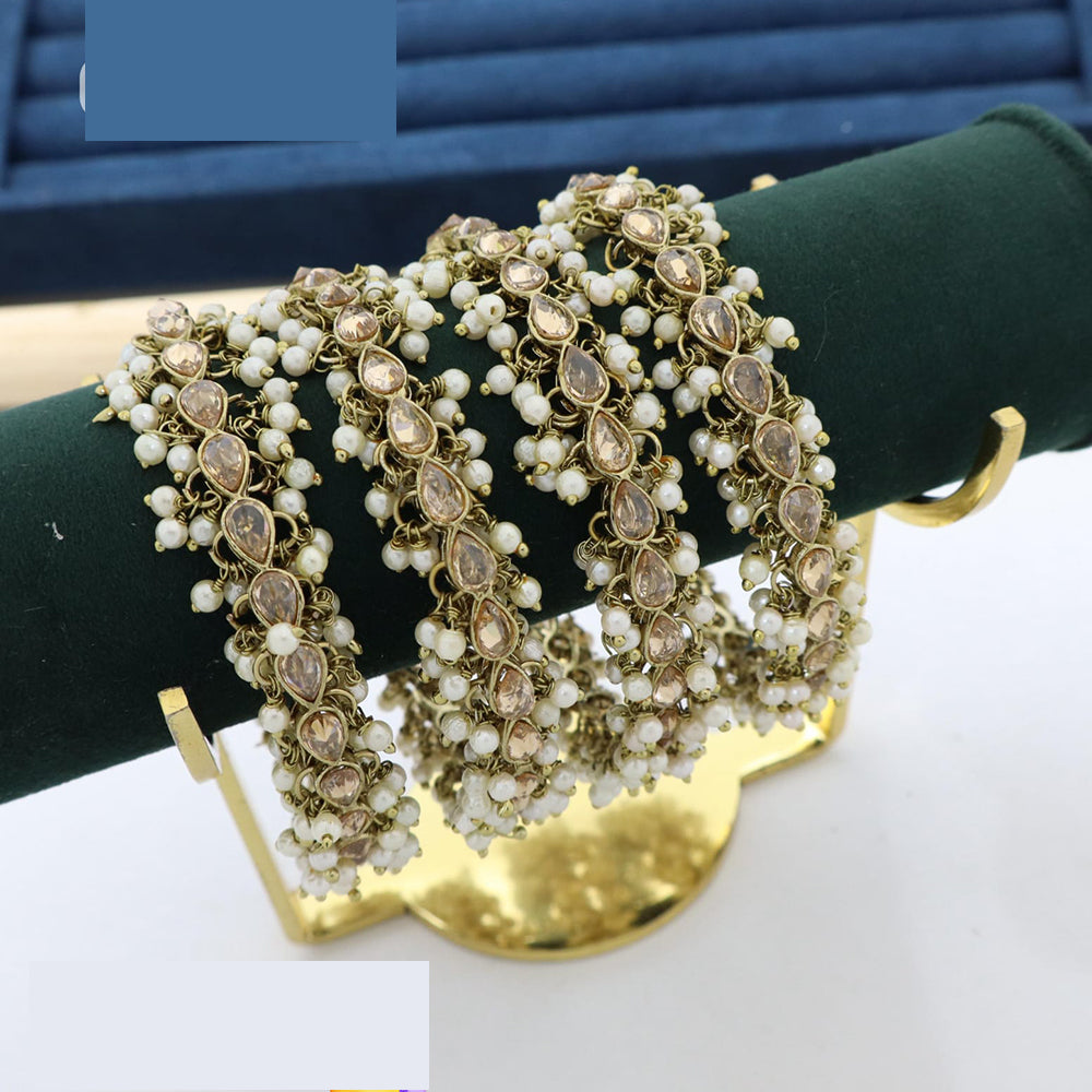 Pooja Bangles Dazzling Crystal And Pearl Bangles Set For All Occassions