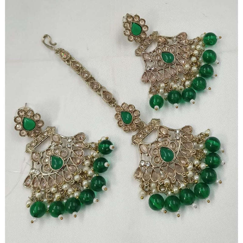 Akruti Collection Gold Plated Crystal Stone Earrings With Maangtikka