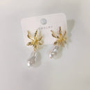 Tarohi Jewels Gold Plated Pearl Dangler Earrings