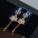 Pooja Sales Rajkot Gold Plated American Diamond Dangler Earrings