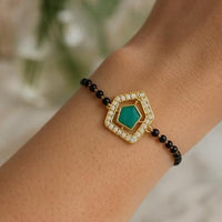 Etnico Gold Plated Traditional Adjustable Black Beads Mangalsutra Bracelet with White Pendant for Women (MB007G)