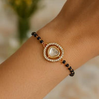 Etnico Gold Plated Traditional Adjustable Black Beads Mangalsutra Bracelet with White Pendant for Women (MB009W)