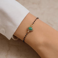 Etnico Gold Plated Traditional Adjustable Black Beads Mangalsutra Bracelet with White Pendant for Women (MB010Min)