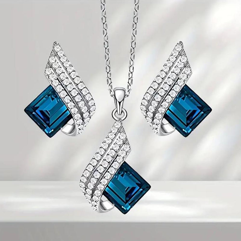 Mahi Shining Angel Wings Shaped Montana Blue and White Crystal Pendant Necklace Earrings Set for Women (NL1103810RMBlu)