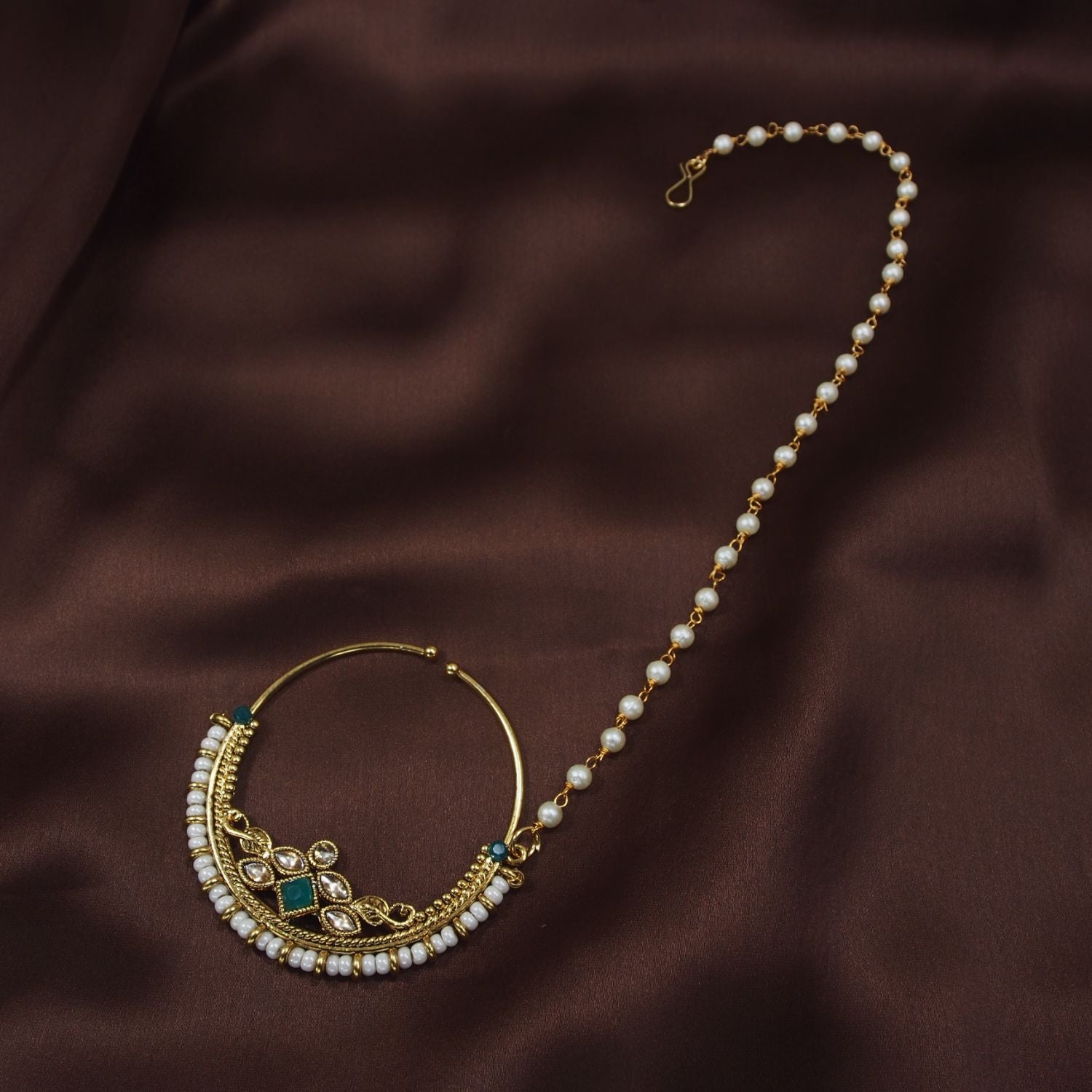 Etnico 18k Gold Plated Traditional Ethnic Bridal Nose Ring/Nath without piercing with Pearl Chain Encased with Pearl Stone for Women (NL38G)