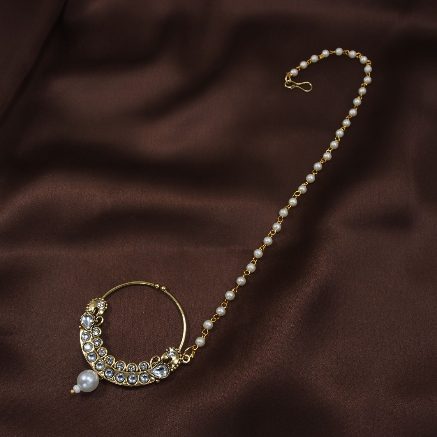 Etnico Gold Plated Traditional Ethnic Bridal Nose Ring/Nath without piercing with Pearl Chain Encased with Pearl Stone for Women/Girls (NL42W)