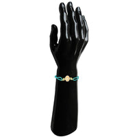 Mahi Elegant Kundan Rakhi for Brother | Oval Centerpiece with Mint Green Accents & Braided Blue Thread (RA1100825G)