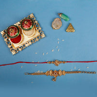 Raddhi Jewels Rajwadi Gold Plated Brass Ruby Stone Glided Floral Design Bhaiya Bhabhi Rakhi Set With Roli Chawal Plate Combo Hamper For Rakshabandhan