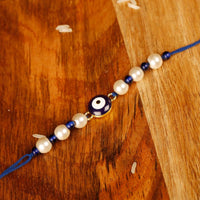 Raddhi Jewels Enamel Evil Eye Pearl Rakhi For Brother/Bhai/Bro