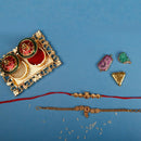 Raddhi Jewels Rajwadi Gold Plated Brass Ruby Stone Glided Floral Design Bhaiya Bhabhi Rakhi Set With Roli Chawal Plate Combo Hamper For Rakshabandhan