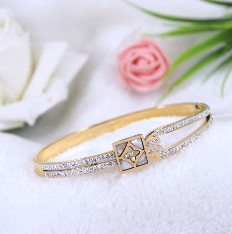 Tarohi Jewels Stainless Steel Gold Plated square Shaped Clover Design Kada- STKD 3785